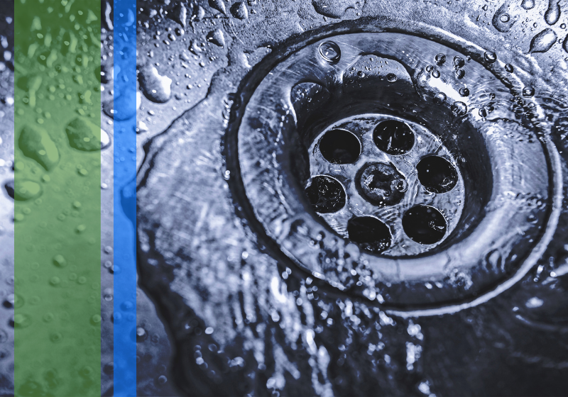 Water flowing neatly down a drain.