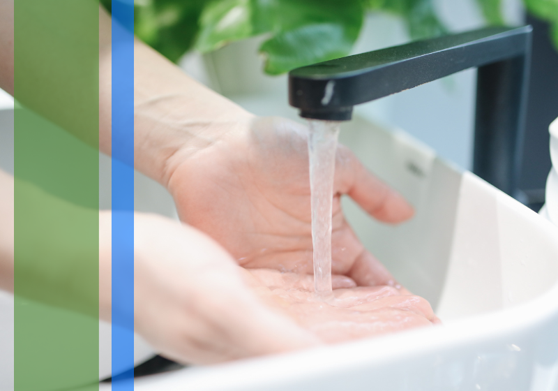 Person washing their hands in a sink