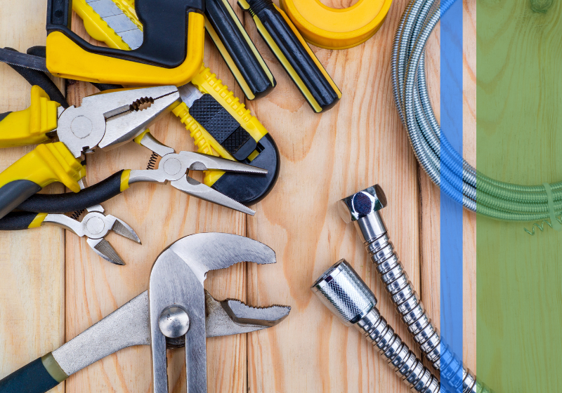 Plumbing tools and supplies sitting on a table