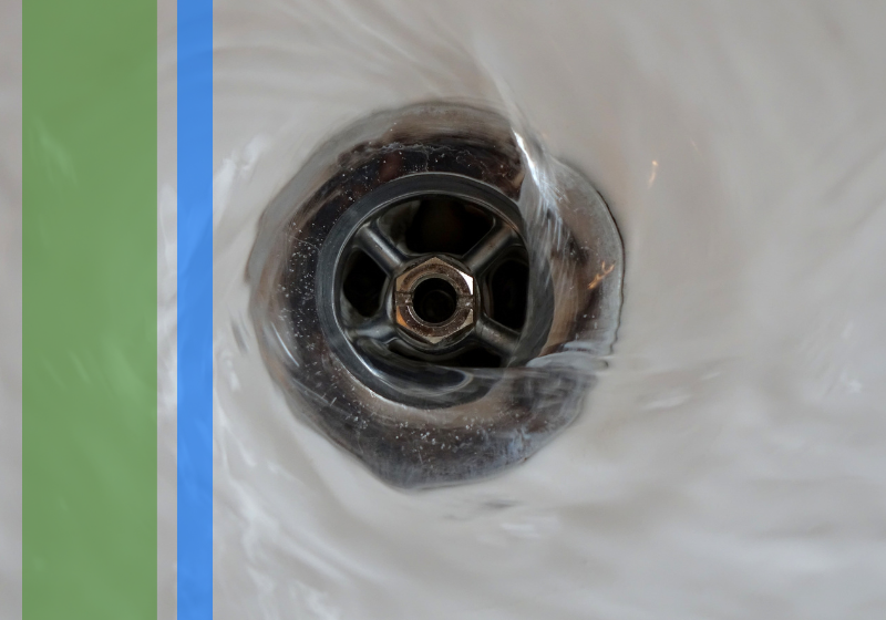 Water flowing neatly down a drain.