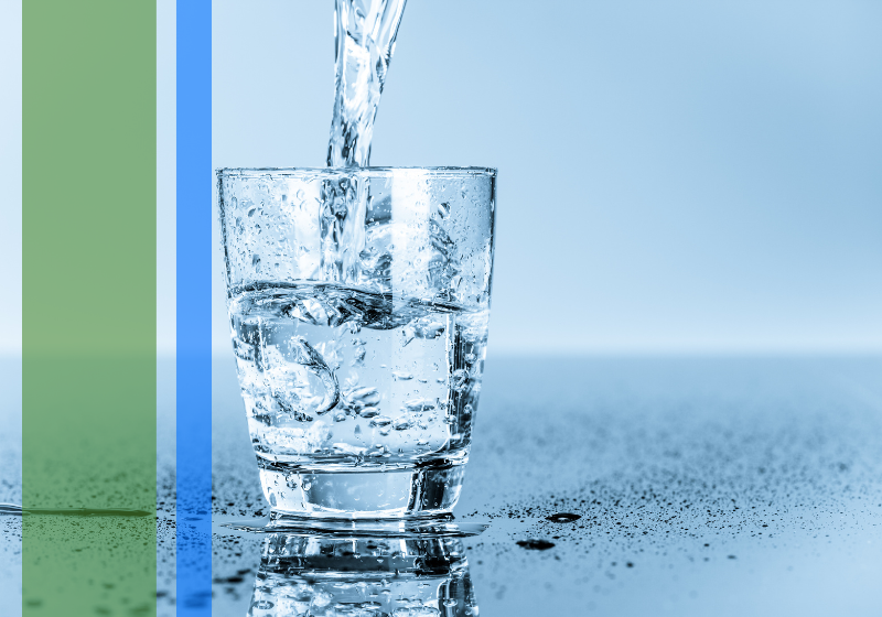 Clear, clean water being poured into a glass.