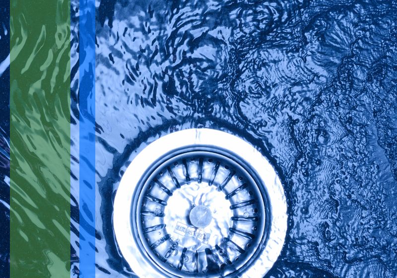 Water flowing down the drain of a sink
