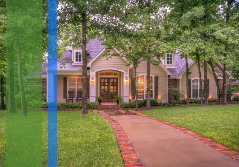A nice house with trees surrounding the exterior