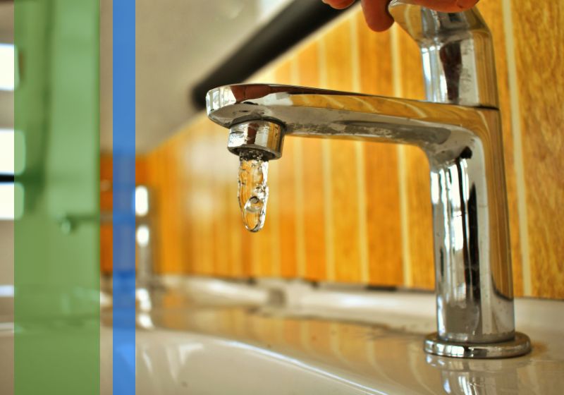 Water running from a bathroom sink faucet.