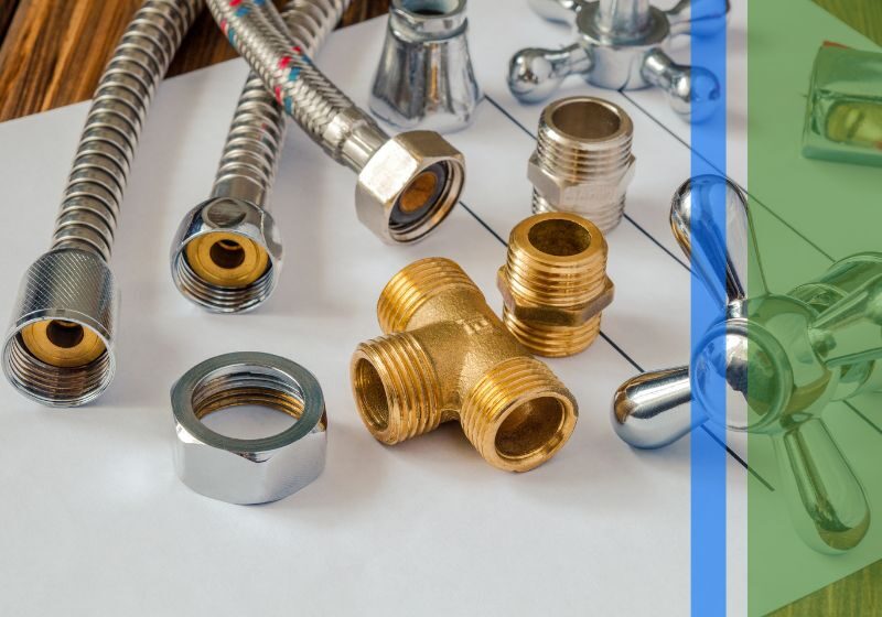 Plumbing parts laid out on a table